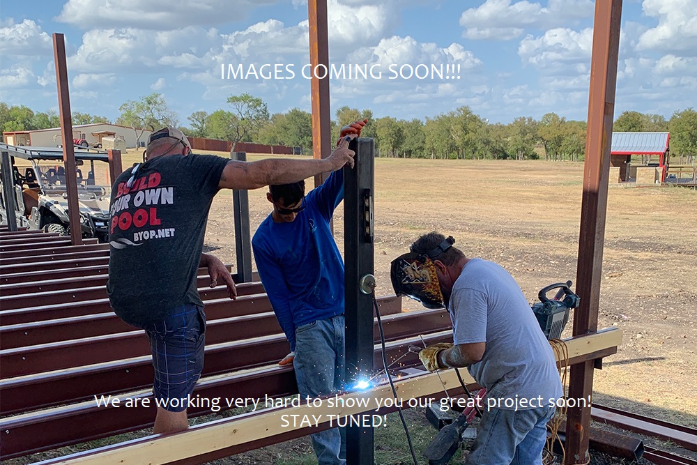 A view of three men working hard on the new lodge for the hunting ranch in Austin, Texas.