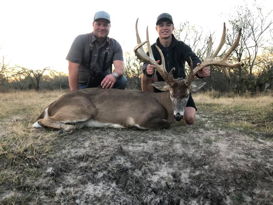 Father and son enjoying a rewarding hunt at the Austin Trophy Whitetails ranch.